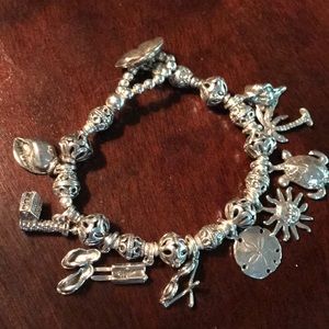 Holding/ for dispute Sterling Silver Charm Bracele